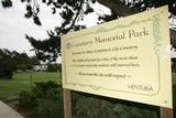 
A sign placed by the City of Ventura states to visitors that the park is the former site of the St. Mary’s Cemetery and City Cemetery and asks that park visitors please treat the site with respect Wednesday at the Cemetery Memorial Park in Ventura. 